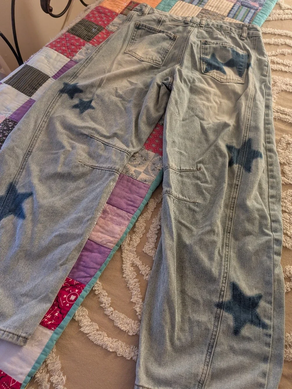 Star jeans, distressed light wash barrel style jeans